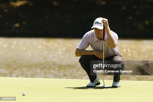 Tim Wilkinson of New Zealand lines up a putt during day one of the Australian PGA Championship at the Hyatt Regency Resort on December 4, 2008 at...