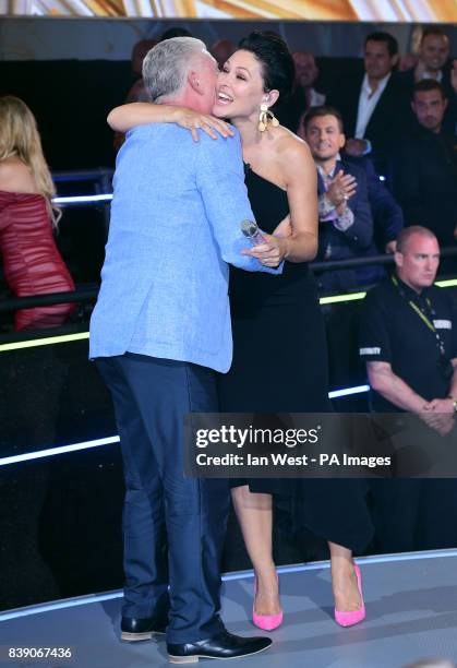 Derek Acorah hugs host Emma Willis during the live final of Celebrity Big Brother, at Elstree Studios in Borehamwood, Hertfordshire.