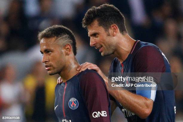 Paris Saint-Germain's Brazilian forward Neymar and Paris Saint-Germain's Italian midfielder Thiago Motta celebrate after winning the French L1...