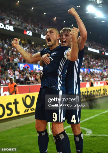 Hamburg's Greek defender Kiriakos Papadopoulos and Hamburg's defender Dennis Diekmeier celebrate after the German First division Bundesliga football...