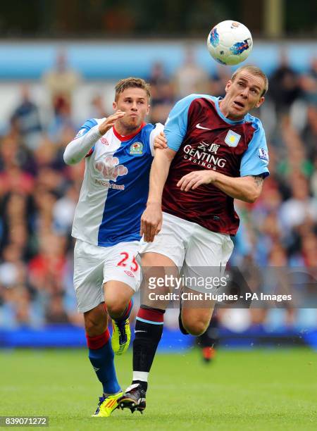 Aston Villa's Richard Dunne and Blackburn's David Goodwillie battle for the ball during the Barclays Premier League match at Villa Park, Birmingham.