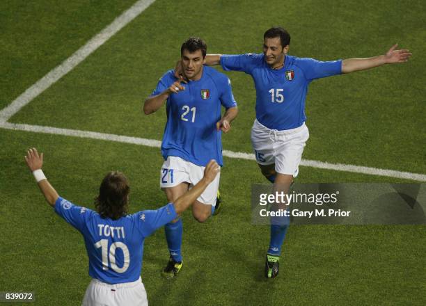 Francesco Totti and Mark Iuliano of Italy congratulate team-mate Christian Vieri after he scored the opening goal of the match during the FIFA World...