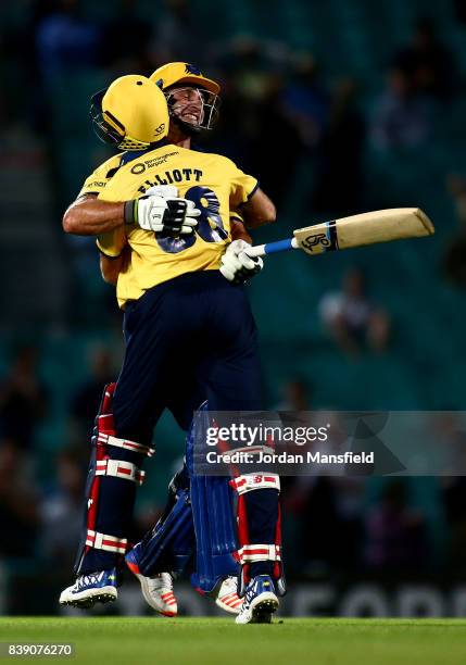 Grant Elliott and Colin de Grandhomme of Birmingham celebrate victory during the NatWest T20 Blast Quarter-Final between Surrey and Birmingham Bears...