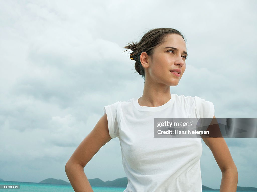 Woman in a white tee at the beach