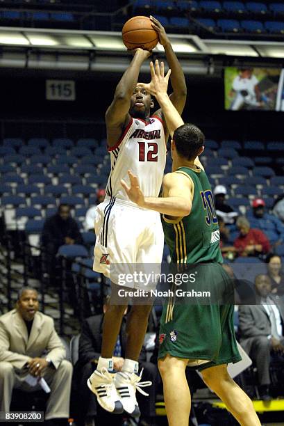 Noel Felix of the Anaheim Arsenal puts up a shot over Jesse Smith of the Reno Bighorns during a D-League game at the Anaheim Convention Center on...