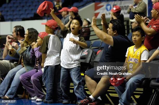 Fans of the Anaheim Arsenal celebrate after the win against the Reno Bighorns during a D-League game at the Anaheim Convention Center on December 3,...