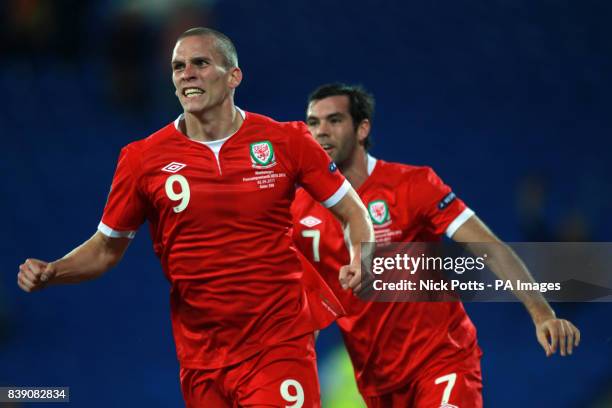 Wales's Steve Morison celebrates scoring the opening goal with Joe Leadley during the European Championship Qualifying match at the Cardiff City...