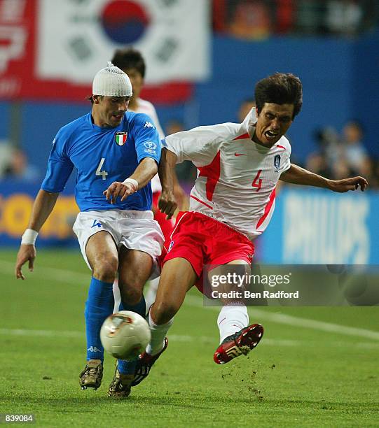 Francesco Coco of Italy blocks the cross going over from Jin Cheul Choi of South Korea during the FIFA World Cup Finals 2002 Second Round match...