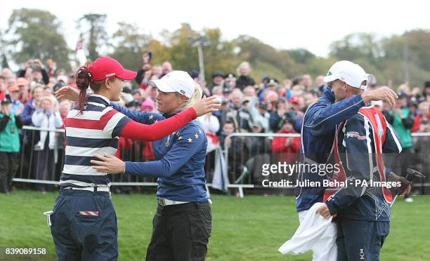 Europe's Suzann Pettersen hugs USA's Michelle Wie on the 18th after winning during day three of the 2011 Solheim Cup at Killeen Castle, County Meath,...