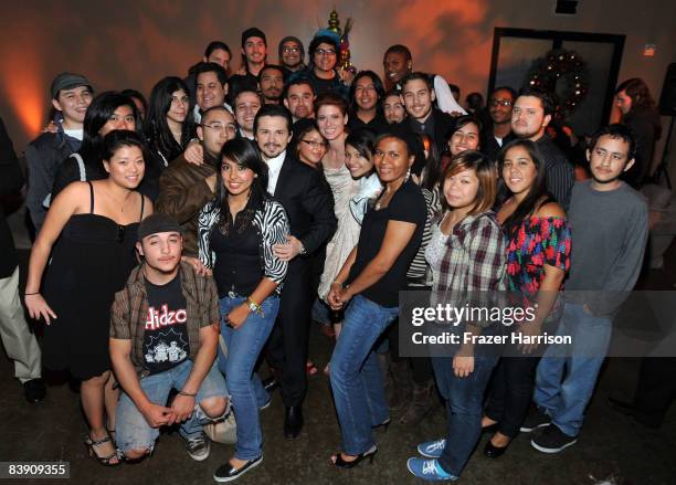 Actor Freddy Rodriguez and actress Debra Messing pose with the Inner City Filmmakers students at the premiere after party for Overture Films'...