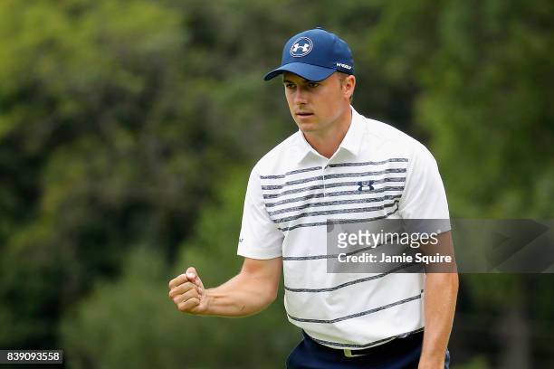Jordan Spieth of the United States reacts after putting for birdie on the 16th green during round two of The Northern Trust at Glen Oaks Club on...