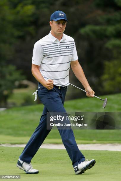 Jordan Spieth of the United States reacts after putting for birdie on the 16th green during round two of The Northern Trust at Glen Oaks Club on...