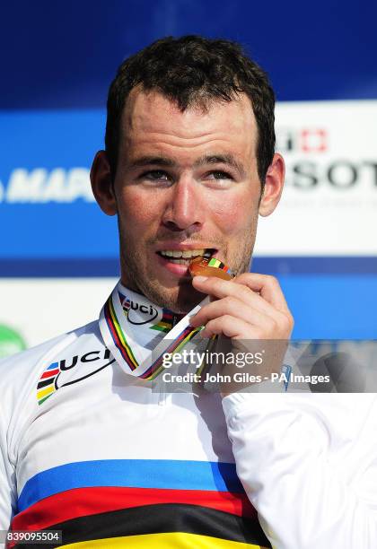 Great Britain's Mark Cavendish poses with his medal as he celebrates winning the Men's Road Race during Day Seven of the UCI Road Race World...