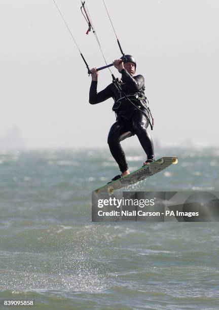 Kite surfer is seen on Dollymount strand in Dublin, as the unseasonably warm weather continues.