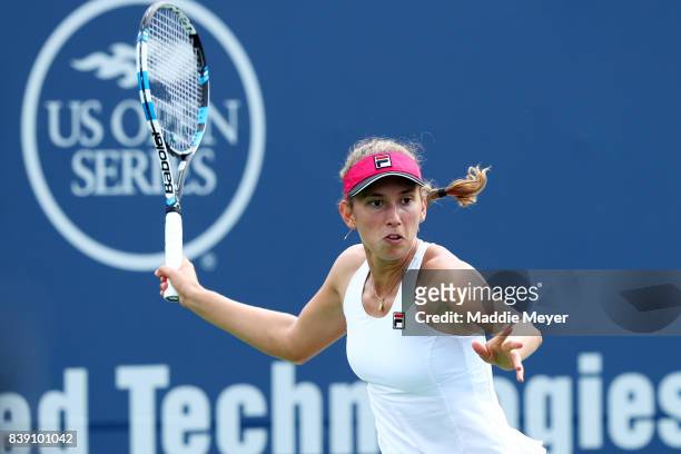 Elise Mertens of Belgium returns a shot to Dominika Cibulkova of Slovakia during Day 7 of the Connecticut Open at Connecticut Tennis Center at Yale...