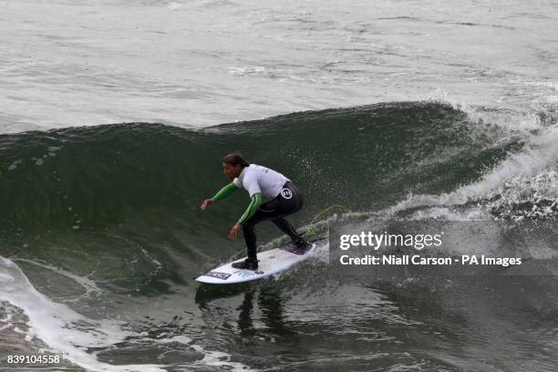 England's Alan Stokes takes part in the men's final of the Open Surf category the European Surfing Championships being held in Bundoran in County...