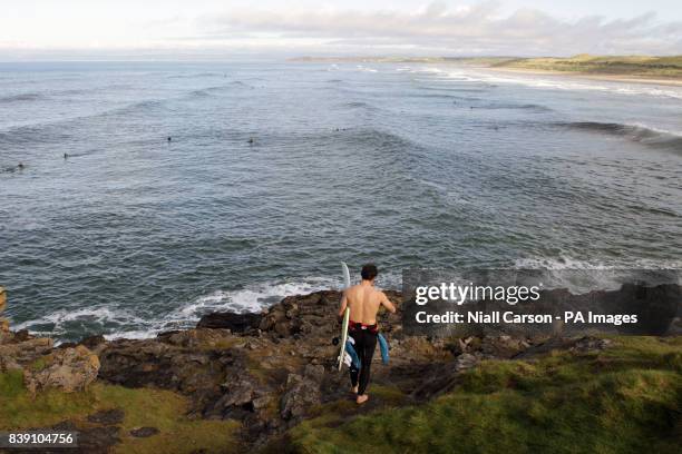 An unknown competitor takes to the waves during a practice session the European Surfing Championships being held in Bundoran in County Donegal,...