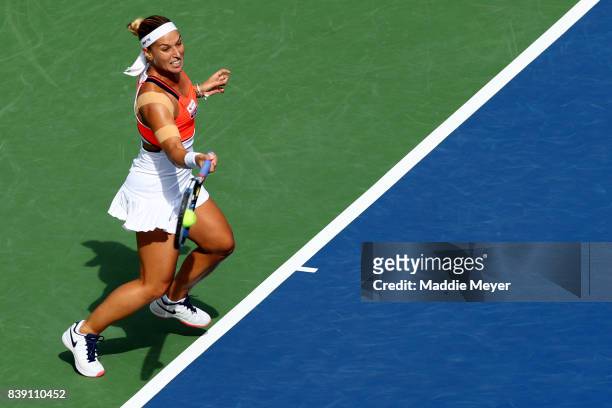 Dominika Cibulkova of Slovakia returns a shot to Elise Mertens of Belgium during Day 7 of the Connecticut Open at Connecticut Tennis Center at Yale...