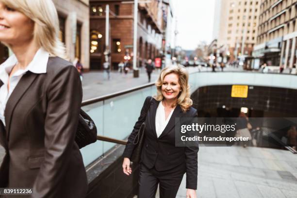 business colleagues walking on the city - 80s business women stock pictures, royalty-free photos & images