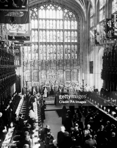 The funeral of King George VI, at St. George's Chapel, Windsor Castle. As the coffin of the king is lowered into the vault below St. George's Chapel,...