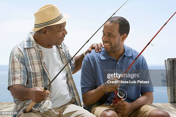 Smiling Senior Man Holding A Fishing Rod High-Res Stock Photo - Getty Images