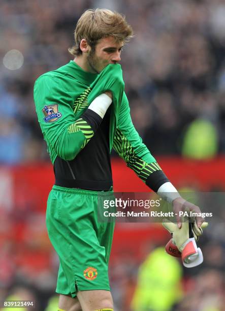 Manchester United's goalkeeper David De Gea leaves the field after the 6-1 defeat against Manchester City during the Barclays Premier League match at...