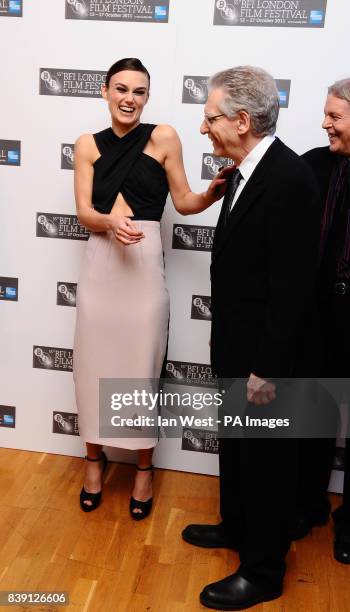 Keira Knightley and David Cronenberg arrive at the premiere of A Dangerous Method at the Odeon West End Cinema, London.