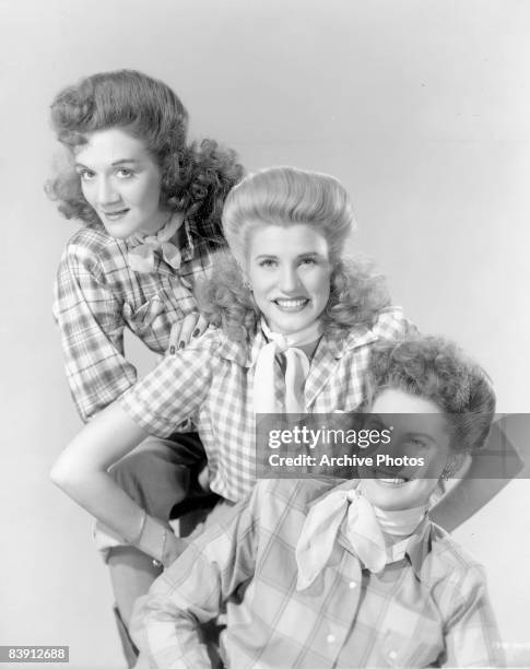 American singing group The Andrews Sisters wearing plaid blouses and neckerchieves, 1944. They are sisters LaVerne Sophie Andrews , Maxene Angelyn...