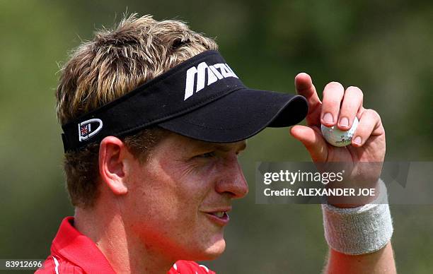 Luke Donald of Britain plays a shot on the 14th green on day one of the South African Golf Nedbank Golf Challenge in Sun City, on December 04, 2008....