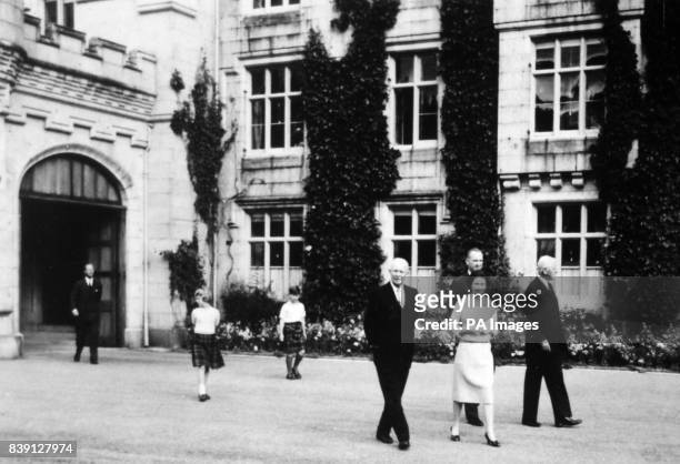 **Scanned low-res off contact** American President Dwight D. Eisenhower walks with the Queen, the Duke of Edinburgh, Prince Charles and Princess...