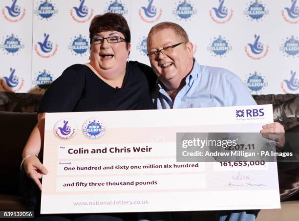 Colin and Chris Weir, from Largs in Ayrshire, pose for photographs during a press conference at the Macdonald Inchyra Hotel & Spa in Falkirk, after...