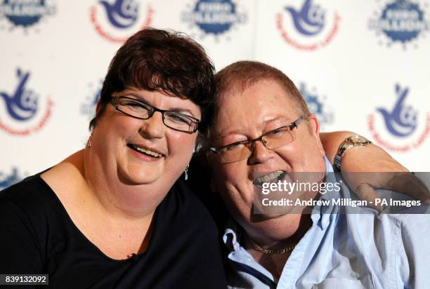 Colin and Chris Weir, from Largs in Ayrshire, pose for photographs during a press conference at the Macdonald Inchyra Hotel & Spa in Falkirk, after...