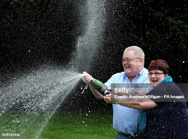 Colin and Chris Weir, from Largs in Ayrshire, celebrate during a photo call at the Macdonald Inchyra Hotel & Spa in Falkirk, after they scooped...