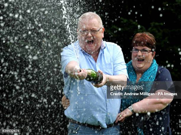 Colin and Chris Weir, from Largs in Ayrshire, celebrate during a photo call at the Macdonald Inchyra Hotel & Spa in Falkirk, after they scooped...