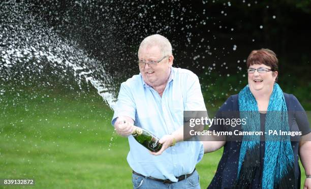 Colin and Chris Weir, from Largs in Ayrshire, celebrate their win at the Macdonald Inchyra Hotel & Spa in Falkirk, after they scooped 161 million in...