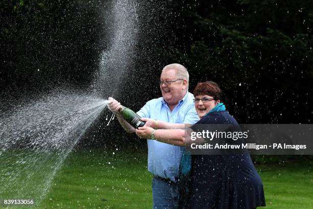 Colin and Chris Weir, from Largs in Ayrshire, celebrate during a photo call at the Macdonald Inchyra Hotel & Spa in Falkirk, after they scooped 161...