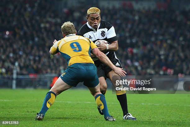 Jerry Collins of The Barbarians is challenged by Brett Sheehan of Australia during the 1908 - 2008 London Olympic Centenary match between The...