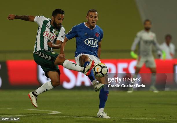 Vitoria Setubal midfielder Joao Costinha from Portugal with CF Os Belenenses midfielder Hassan Yebda from Algeria in action during the Primeira Liga...