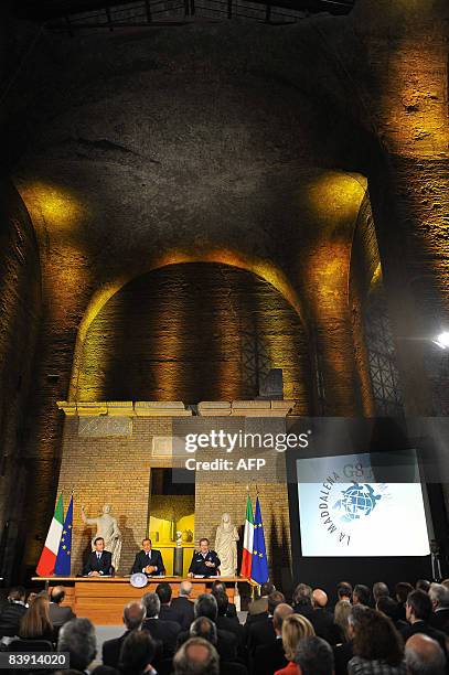 Italian Prime Minister Silvio Berlusconi , flanked by Italian Foreign Minister Franco Frattini and the head of the Civil Protection Guido Bertolaso,...