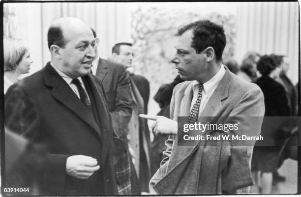 American art critic Clement Greenberg speaks with Art News managing editor Thomas Hess at the Poindexter Gallery , New York, New York, February 20,...