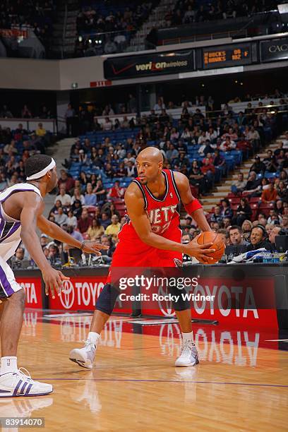 Jarvis Hayes of the New Jersey Nets drives the ball against John Salmons of the Sacramento Kings during the game on November 26, 2008 at Arco Arena...