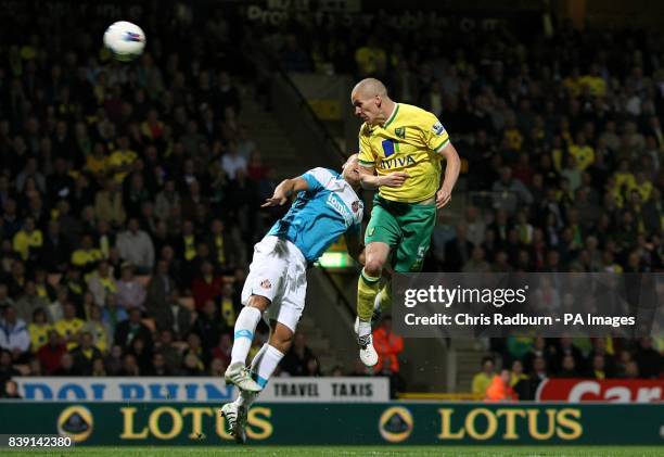 Norwich City's Steve Morison rises high to head home his side's second goal of the game