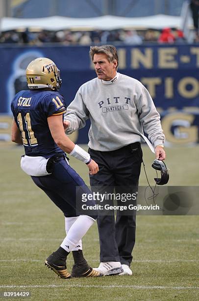 Head coach Dave Wannstedt of the University of Pittsburgh Panthers talks to quarterback Bill Stull during a Big East Conference college football game...