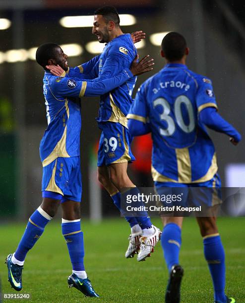 Arnold Mvuemba Makengo of Portsmouth celebrates the second goal with Nadir Belhadj during the UEFA Cup Group E match between VfL Wolfsburg and...