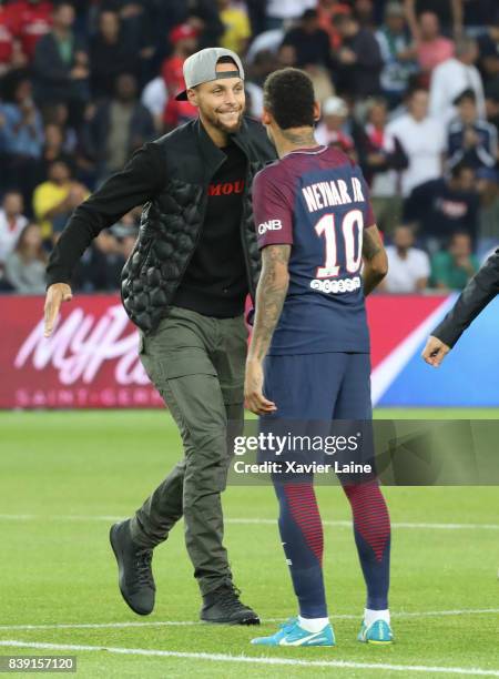 Stephen Curry kickoff the game with Neymar Jr of Paris Saint-Germain before the French Ligue 1 match between Paris Saint Germain and AS Saint-Etienne...