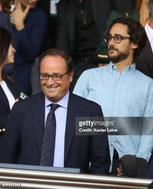 French former president Francois Hollande and his son Thomas Hollande attend the French Ligue 1 match between Paris Saint Germain and AS...