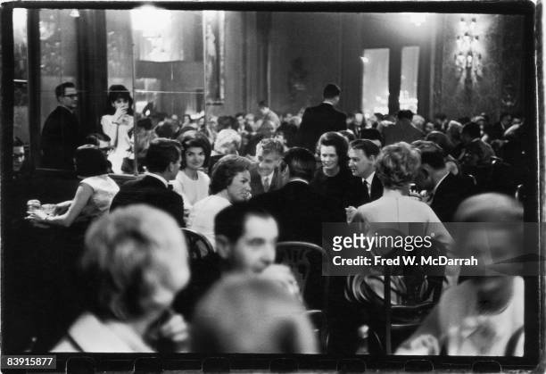 View of the crowded dining room at the Metropolitan Opera House, New York, New York, April 1965. Attending a performance of the Royal Ballet, and...