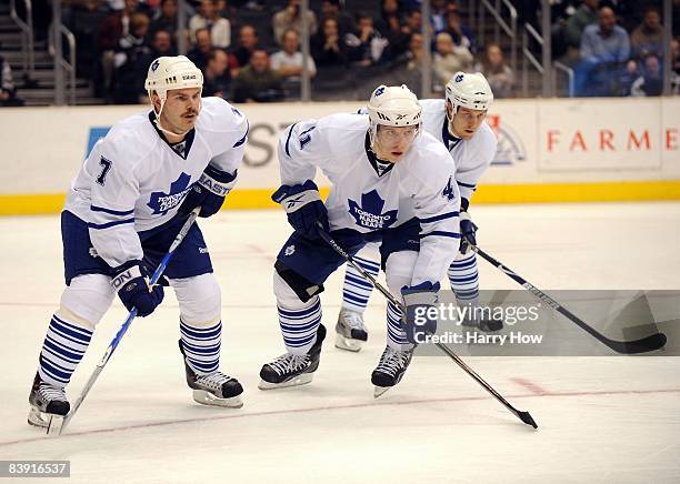 Nikolai Kulemin, Ian White and Niklas Hagman of the Toronto Maple Leafs wait for a face off against the Los Angeles Kings during the game at the...