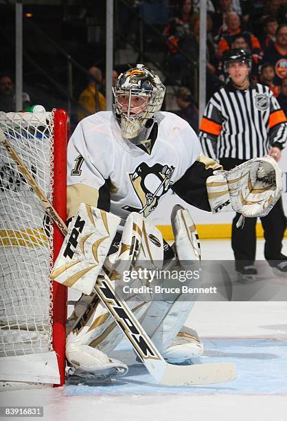 Goaltender John Curry of the Pittsburgh Penguins watches play behind the net against the New York Islanders during their NHL game on November 26,...