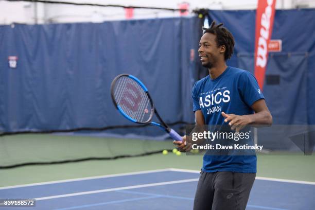 Gael Monfils surprises and join unsuspecting fans for A few games on court fans at Arthur Ashe Stadium on August 25, 2017 in New York City.